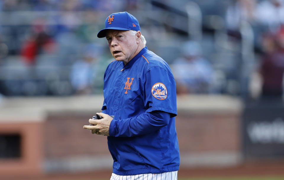 New York Mets manager Buck Showalter goes to the dugout during the ninth inning of a baseball game against the Philadelphia Phillies, Sunday, Oct. 1, 2023, in New York. (AP Photo/Noah K. Murray)