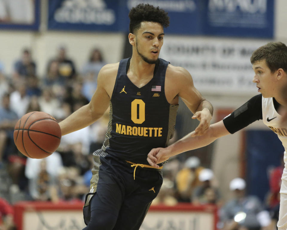 Marquette guard Markus Howard tied a Big East record with 52 points on Wednesday night. (AP Photo/Marco Garcia)