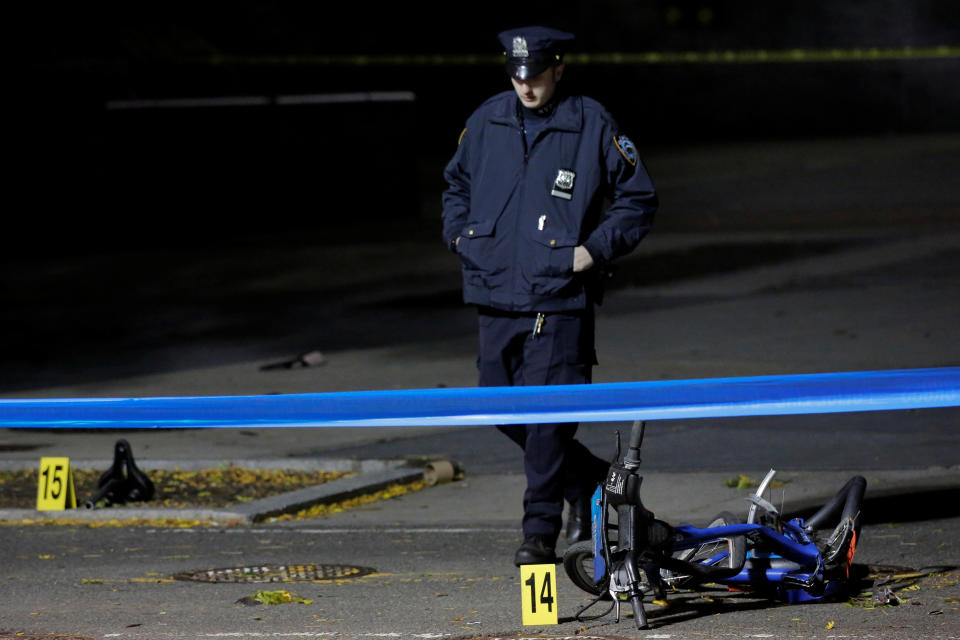 <p>A police officer investigates crushed bicycles on a bicycle lane the day after a pickup truck attack on the West Side Highway in Manhattan, New York, Nov. 1, 2017. (Photo: Andrew Kelly/Reuters) </p>