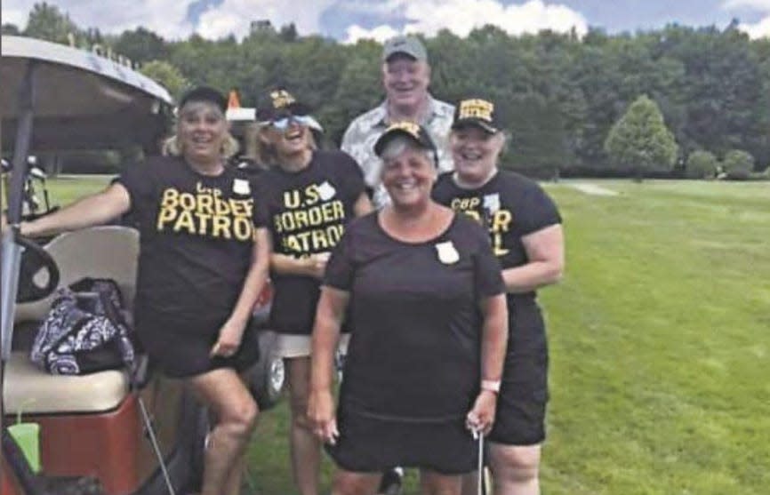 The golf team wore black t-shirts and hats emblazoned with the words "border patrol" and drove a cart decorated as the U.S. Mexico border wall. (Credit: Erie News Now)