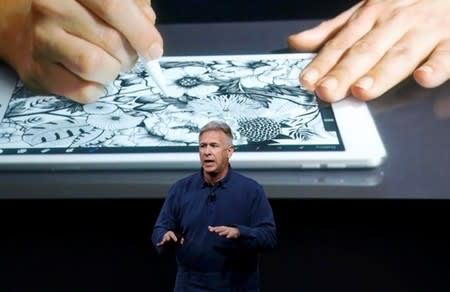 Phil Schiller, senior VP of worldwide marketing for Apple, introduces the iPad Pro with 9.7-inch display during an event at the Apple headquarters in Cupertino, California March 21, 2016. REUTERS/Stephen Lam