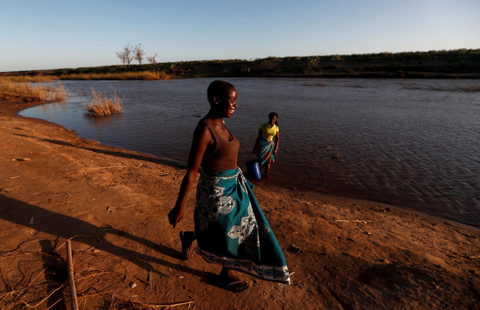Maria Jofresse, 25, walks at the edge of the Muda River to meet her father Joao Jofresse, who works on a water taxi, in the village of Cheia which means "Flood" in Portuguese, near Beira, Mozambique, April 2, 2019. (Photo: Zohra Bensemra/Reuters) 
