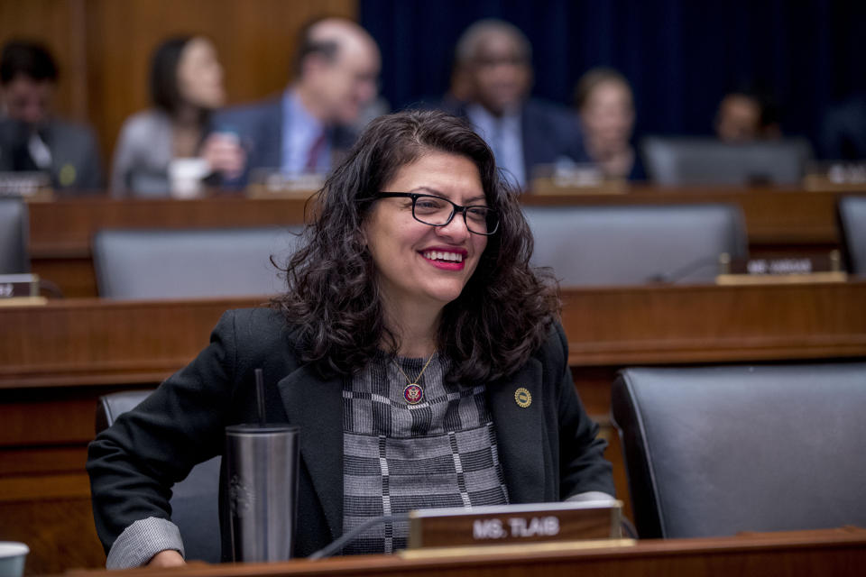 Rep. Rashida Tlaib, D-Mich., appears before Facebook CEO Mark Zuckerberg arrives for a House Financial Services Committee hearing on Capitol Hill in Washington, Wednesday, Oct. 23, 2019, on Facebook's impact on the financial services and housing sectors. (AP Photo/Andrew Harnik)