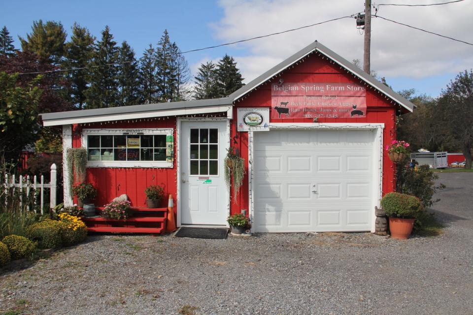 A red barn containing a small store.