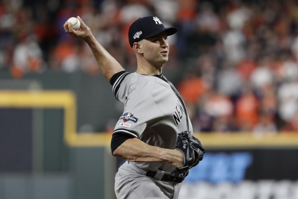 FILE - In this Oct. 13, 2019, file photo, New York Yankees pitcher J.A. Happ throws against the Houston Astros during the 11 inning in Game 2 of baseball's American League Championship Series in Houston. Happ is likely to be among the pitchers the Yankees use in Game 4, manager Aaron Boone said Monday, Oct. 14, 2019. Happ gave up a game-ending home run to Houston’s Carlos Correa in Game 2. ( AP Photo/Eric Gay, File)