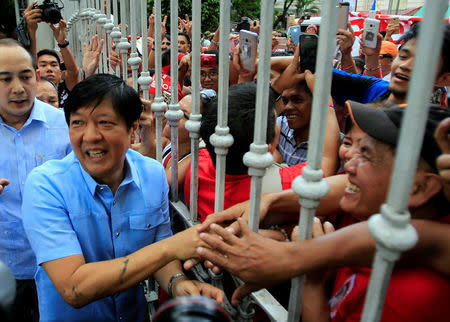 Former senator Ferdinand "Bongbong" Marcos Jr and son of late former dictator Ferdinand Marcos is greeted by his supporters upon his arrival at the Supreme Court in metro Manila, Philippines April 17, 2017. REUTERS/Romeo Ranoco