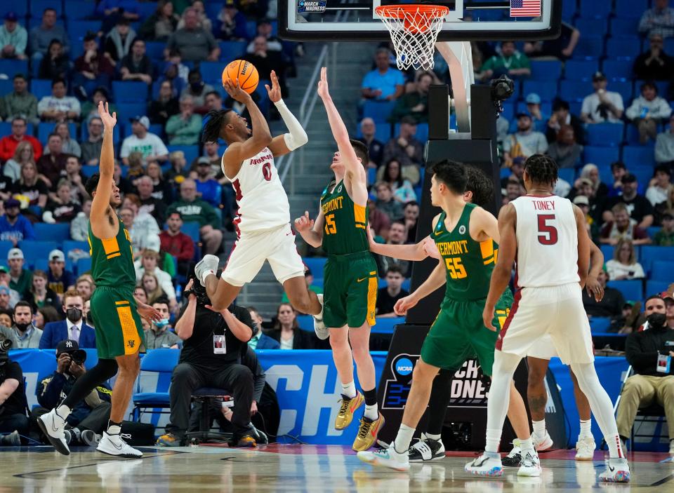 Mar 17, 2022; Buffalo, NY, USA; Arkansas Razorbacks guard Stanley Umude (0) shoots over Vermont Catamounts guard Finn Sullivan (15) in the second half during the first round of the 2022 NCAA Tournament at KeyBank Center. Mandatory Credit: Gregory Fisher-USA TODAY Sports