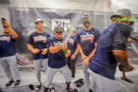 Cleveland Guardians players celebrate winning the American League Central after defeating the Texas Rangers in a baseball game in Arlington, Texas on Sunday, Sept. 25, 2022. (AP Photo/Gareth Patterson)
