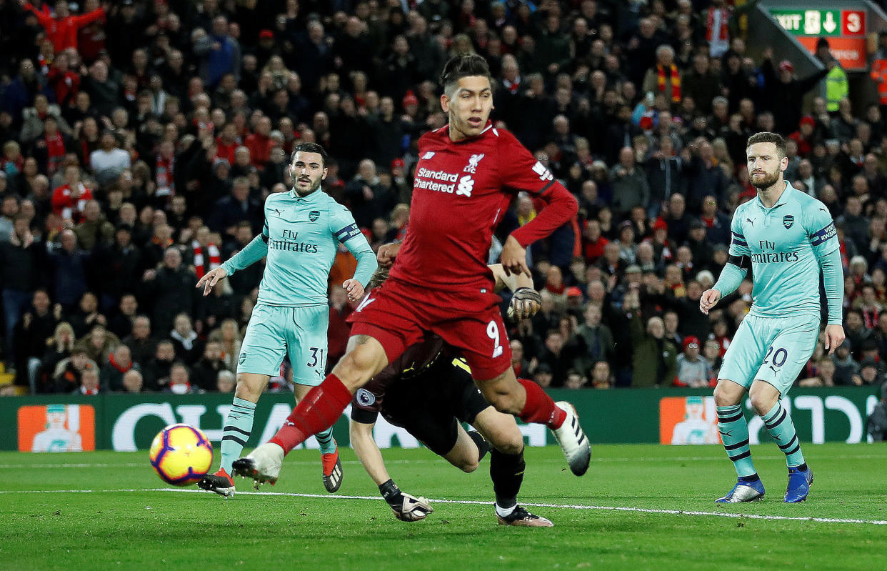 Liverpool’s Roberto Firmino scores their first goal against Arsenal on 29 December, 2018. (PHOTO: Action Images via Reuters/Carl Recine)