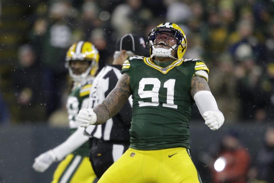 FILE - In this Nov. 10, 2019, file photo, Green Bay Packers' Preston Smith reacts after sacking Carolina Panthers' Kyle Allen during the first half of an NFL football game in Green Bay, Wis. Za’Darius Smith and Preston Smith aren’t related, but the Packers pass rushers share the same last name and the same type of productive games. They combined for 25 ½ sacks last season after both signed with the Packers as free agents in early 2019.(AP Photo/Jeffrey Phelps, File)