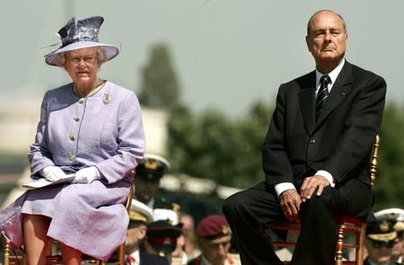 FILE PHOTO: File photo of Britain's Queen Elizabeth and French President Jacques Chirac watching events at the Commonwealth War Graves Cemetery in Bayeux