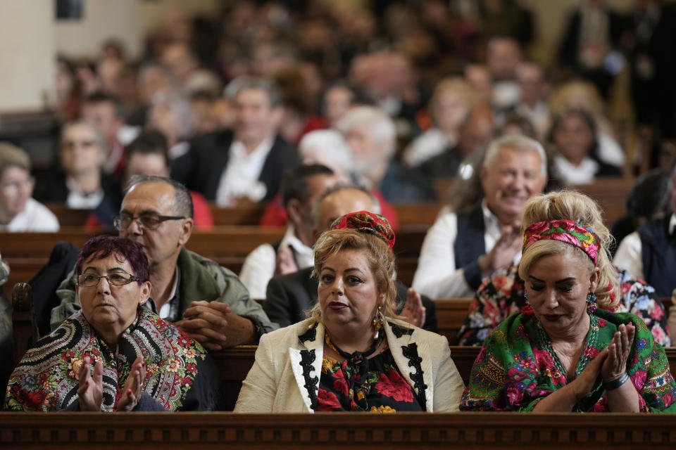 People wait Pope Francis inside the St. Elizabeth of Hungary Church in Budapest, Hungary, Saturday, April 29, 2023. The Pontiff is in Hungary for a three-day pastoral visit. (AP Photo/Andrew Medichini)