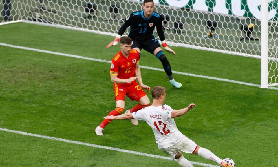 Denmark’s Kasper Dolberg fires in his second goal against Wales.