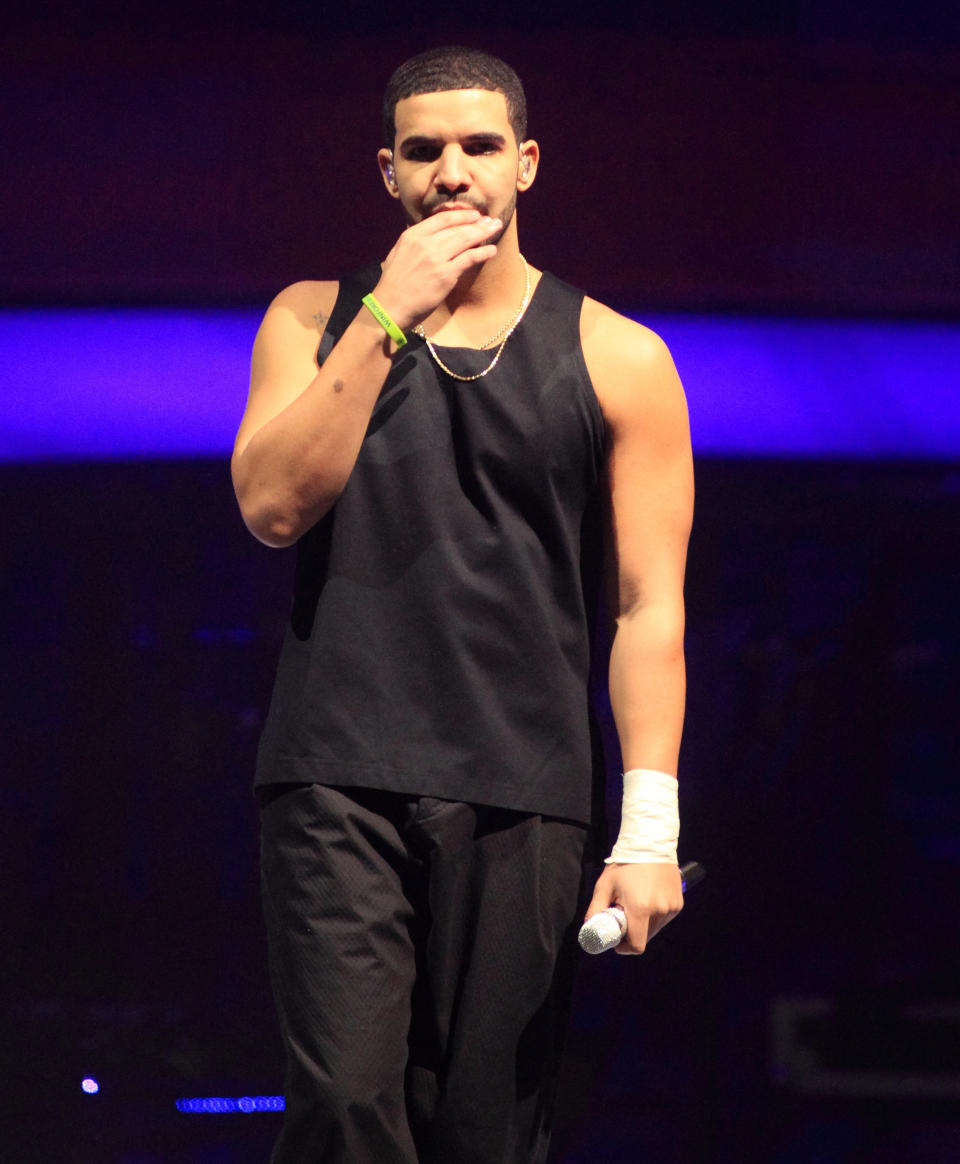 Rapper Drake performs in concert on the last date of his "Would You Like A Tour? 2013" at the Wells Fargo Center on Wednesday, Dec. 18, 2013, in Philadelphia. (Photo by Owen Sweeney/Invision/AP)