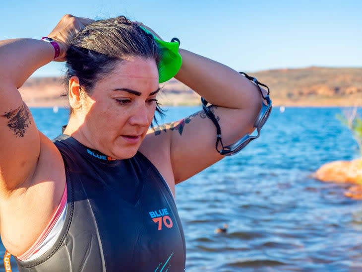 An athlete models a Best plus-size wetsuits for XL, XXL, XXL triathletes