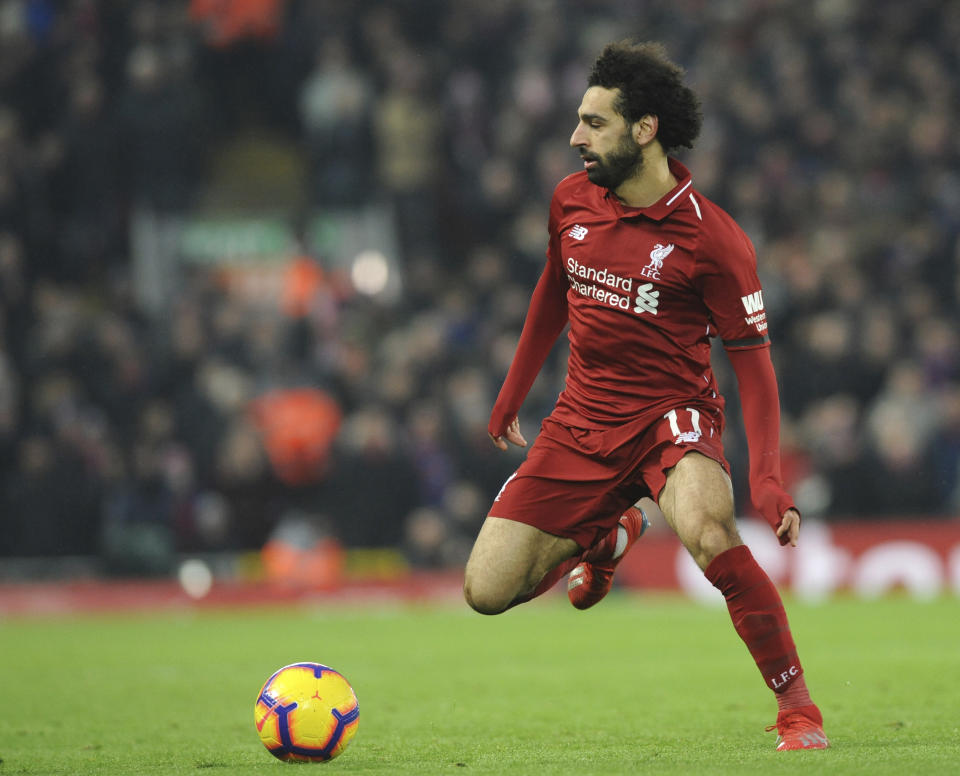Liverpool's Mohamed Salah controls the ball during the English Premier League soccer match between Liverpool and Crystal Palace at Anfield in Liverpool, England, Saturday, Jan. 19, 2019. (AP Photo/Rui Vieira)