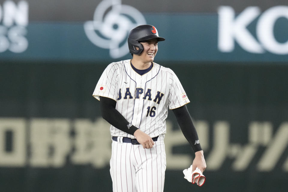 Shohei Ohtani of Japan smiles on second base during the fifth inning of the quarterfinal game between Italy and Japan at the World Baseball Classic (WBC) at Tokyo Dome in Tokyo, Japan, Thursday, March 16, 2023. (AP Photo/Eugene Hoshiko)