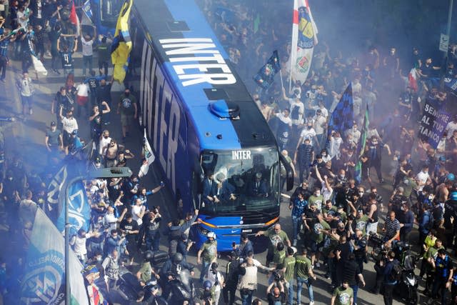 Inter Milan fans welcome the team bus ahead of the Serie A champions' game against Sampdoria