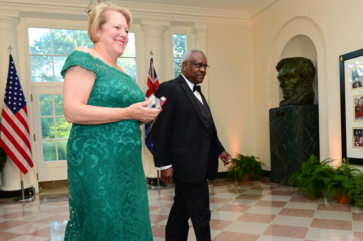 Supreme Court Justice Clarence Thomas arrives with his wife, Ginni, for a state dinner at the White House.