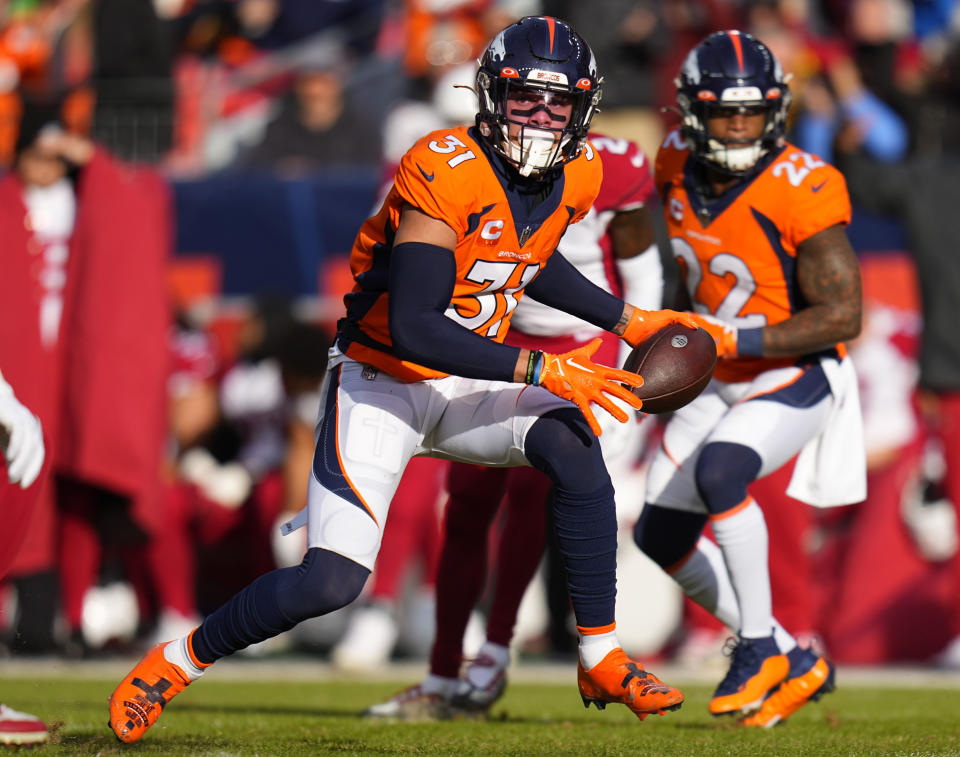 FILE - Denver Broncos safety Justin Simmons (31) runs after intercepting the ball against the Arizona Cardinals during the first half of an NFL football game Dec. 18, 2022, in Denver. Simmons is tied with Pittsburgh Steelers' Minkah Fitzpatrick with 22 takeaways the last four seasons and has consistently been one of the best deep safeties since entering the league in 2016.(AP Photo/Jack Dempsey, File)