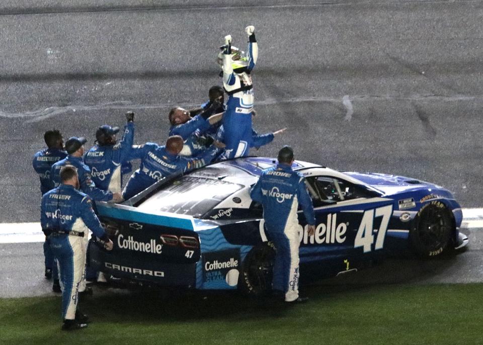 Ricky Stenhouse Jr. climbs out of his No. 47 Chevrolet and celebrates with his crew after winning the Daytona 500 on Sunday night.