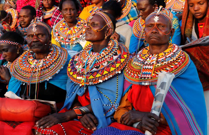 Maasai women dressed in traditional regalia attend a memorial service for late former Kenya's President Daniel Arap Moi at the Nyayo Stadium in Nairobi