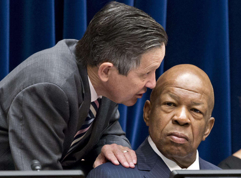 Rep. Dennis Kucinich, D-Ohio, left, confers with Rep. Elijah Cummings, D-Md., right, as the House Oversight and Government Reform Committee considers a vote to hold Attorney General Eric Holder in contempt of Congress, on Capitol Hill in Washington, Wednesday, June 20, 2012. (AP Photo/J. Scott Applewhite)