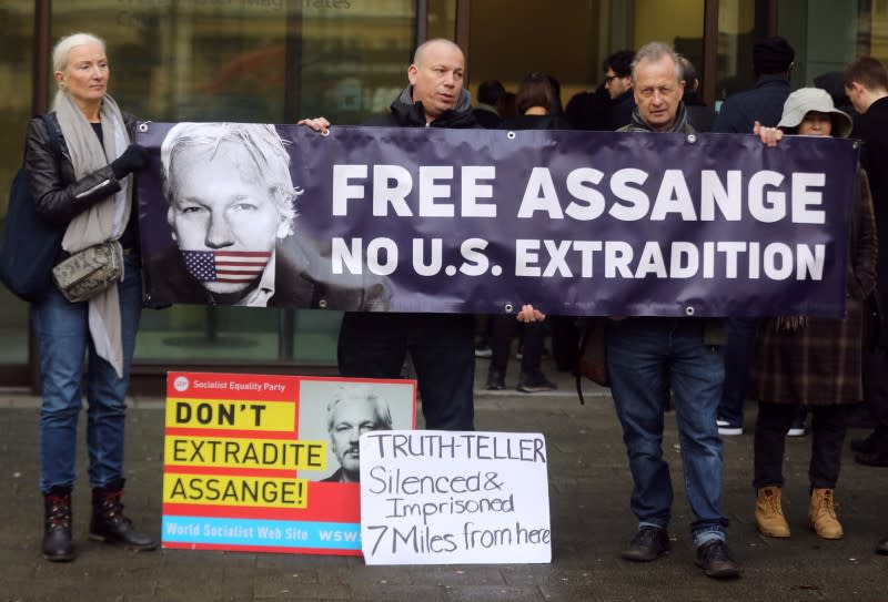 Supporters of WikiLeaks' founder Julian Assange gather outside Westminster Magistrates Court in London