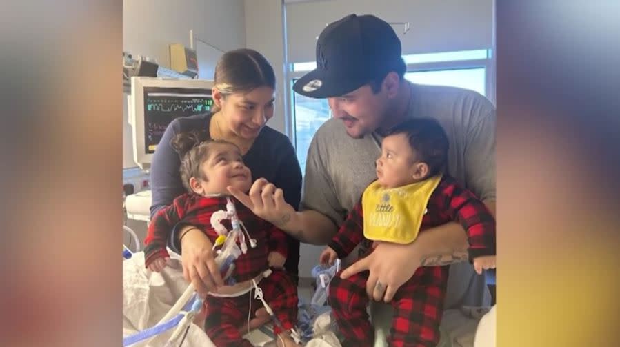 Frankie Corona seen with his parents and baby brother in the hospital.