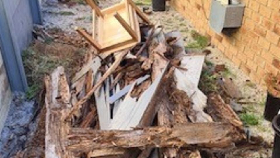 A pile of debris that was collected from the Melbourne home involved in the bitter bill dispute.