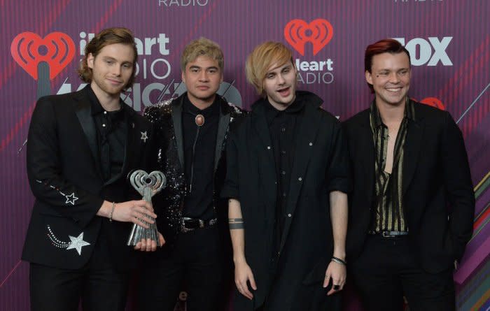 From left, Luke Hemmings, Calum Hood, Michael Clifford, and Ashton Irwin of 5 Seconds of Summer appear backstage during the sixth annual iHeartRadio Music Awards at the Microsoft Theater in Los Angeles on March 14, 2019. File Photo by Jim Ruymen/UPI
