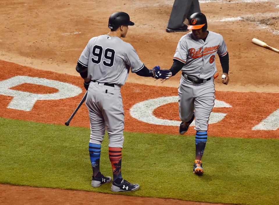 <p>American League infielder Jonathan Schoop (6) of the Baltimore Orioles celebrates with outfielder Aaron Judge (99) of the New York Yankees after scoring a run in the fifth inning during the 2017 MLB All-Star Game at Marlins Park. (Jasen Vinlove-USA TODAY Sports) </p>