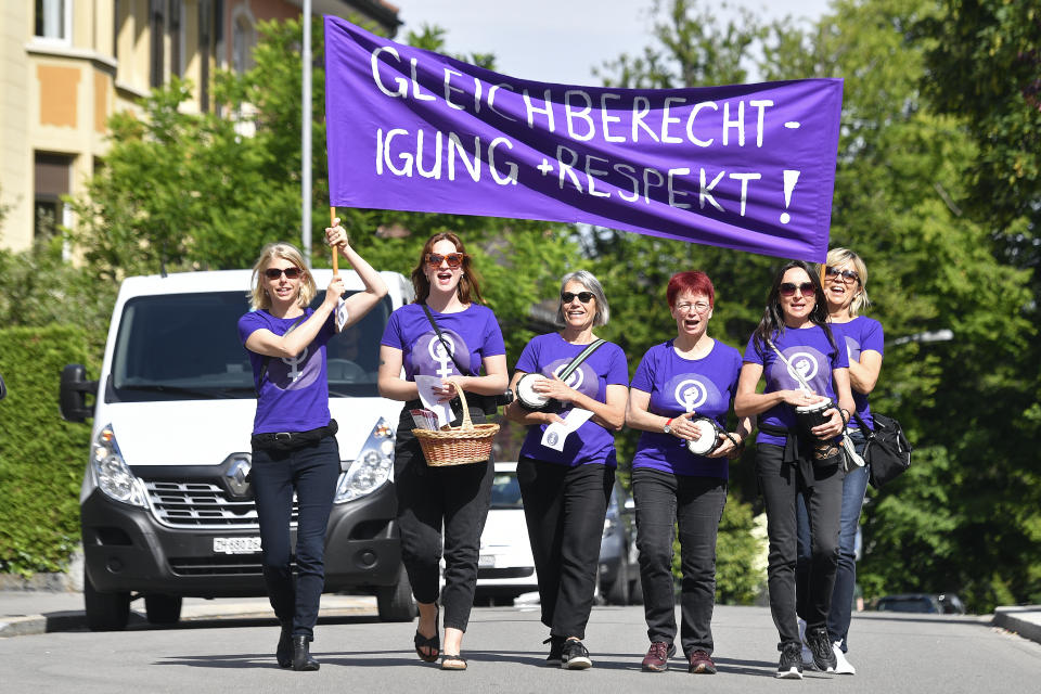 Female teachers protest during a nationwide women's strike on Friday, June 14, 2019, in Zurich, Switzerland. There is list of several reasons motivating people to take part in the strike. These range from unequal wages to pressures on part-time employees, the burden of household work and sexual violence. (Walter Bieri/Keystone via AP)