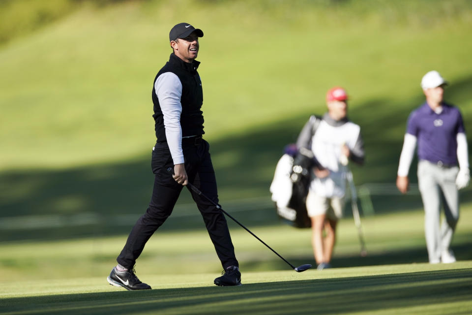 Rory McIlroy, of Northern Ireland, reacts after hitting his second shot on the 17th hole during the second round of the Genesis Invitational golf tournament at Riviera Country Club, Friday, Feb. 19, 2021, in the Pacific Palisades area of Los Angeles. (AP Photo/Ryan Kang)