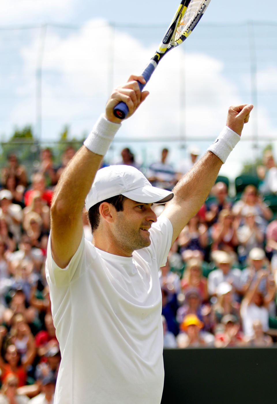 LONDON, ENGLAND - JUNE 30: Brian Baker the USA celebrates winning his Gentlemen's Singles third round match against Benoit Paire of France on day six of the Wimbledon Lawn Tennis Championships at the All England Lawn Tennis and Croquet Club at Wimbledon on June 30, 2012 in London, England. (Photo by Paul Gilham/Getty Images)