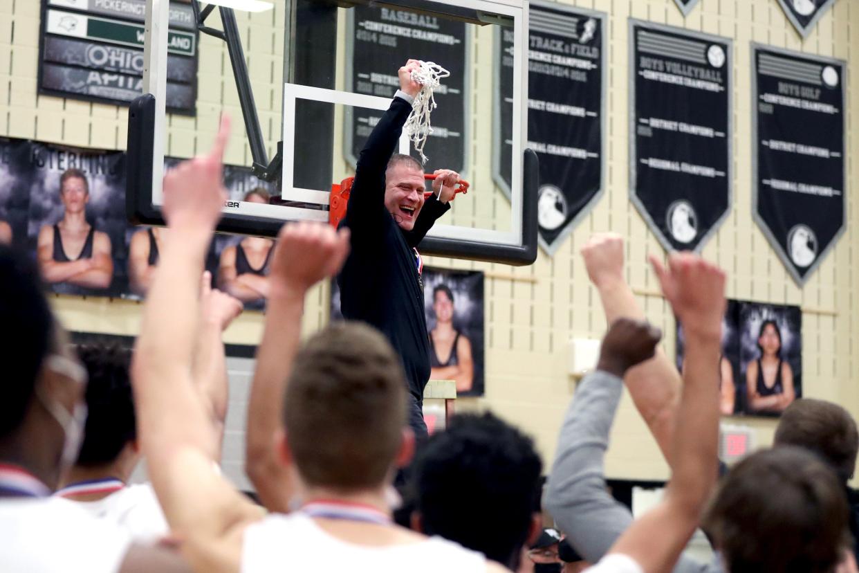 Westerville Central coach Kevin Martin celebrates his team's Division I district title in 2021.