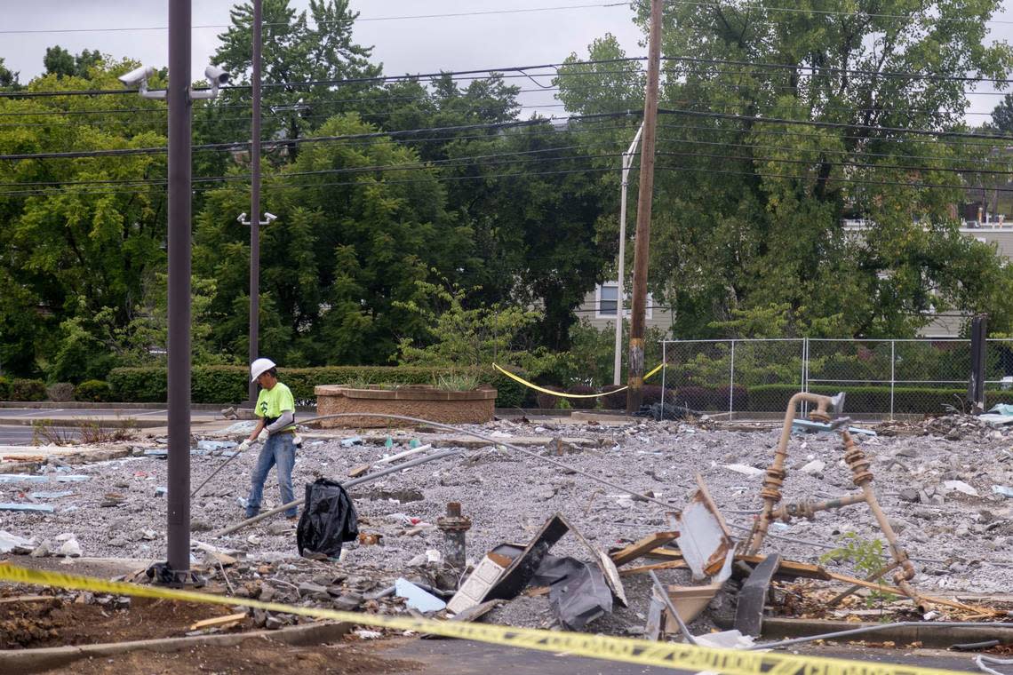 Worker removes debris on Wednesday, July 17, 2024, at the former Coba Cocina restaurant at 2041 Richmond Rd. in Lexington, Kentucky.