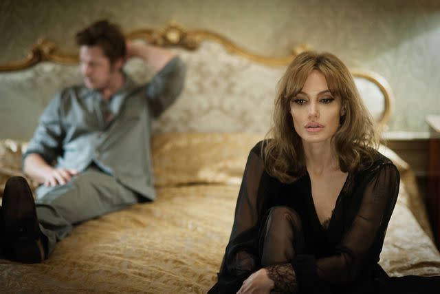 <p>Merrick Morton/Universal/Jolie Pas/Pellikola/Plan B/Kobal/Shutterstock</p> Brad Pitt and Angelina Jolie acting in 'By The Sea.'