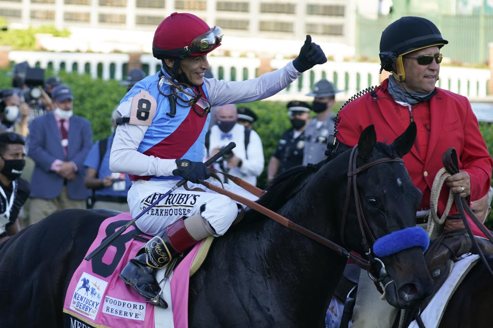 Jockey John Velazquez onboard Medina Spirit gives a thumbs up after winning the 147th running of the Kentucky Derby at Churchill Downs, Saturday, May 1, 2021, in Louisville, Ky. (AP Photo/Brynn Anderson)