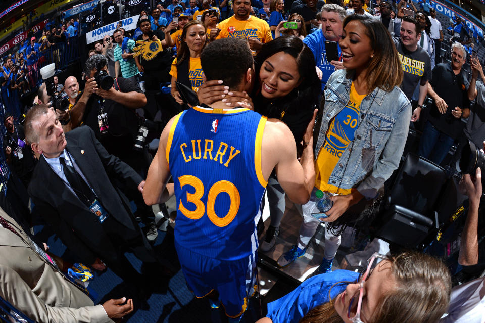 OKLAHOMA CITY, OK - MAY 28: Stephen Curry #30 of the Golden State Warriors celebrates with his wife Ayesha as he leaves the court after Game Six of the Western Conference Finals against the Oklahoma City Thunder during the 2016 NBA Playoffs on May 28, 2016 at Chesapeake Energy Arena in Oklahoma City, Oklahoma.&nbsp;