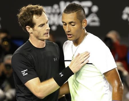 Andy Murray of Britain speaks with Nick Kyrgios (R) of Australia after defeating him in their men's singles quarter-final match at the Australian Open 2015 tennis tournament in Melbourne January 27, 2015. REUTERS/Athit Perawongmetha