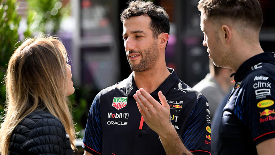 Daniel Ricciardo in conversation with Red Bull Racing staff.