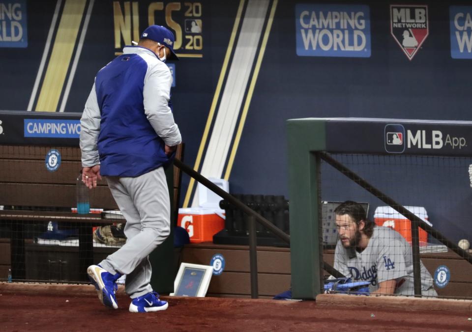 Dodgers starter Clayton Kershaw sits in the dugout moments after being removed from the game.