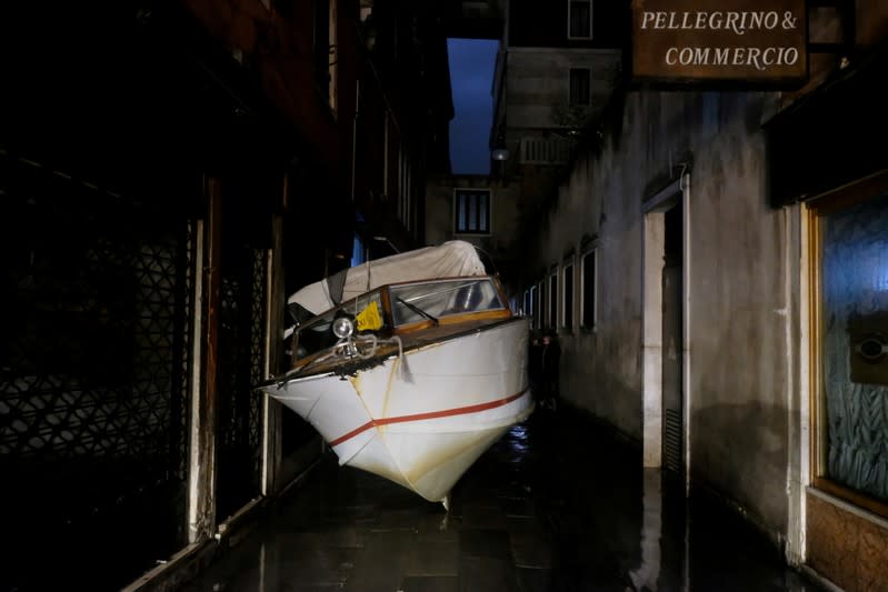 A water taxi transported by floods into a street during a night of record-high flooding is seen in Venice, Italy