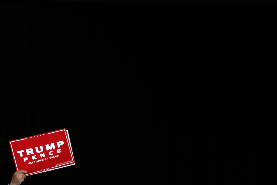 FILE - In this Feb. 21, 2020, file photo a supporter of President Donald Trump holds up a sign during a Trump campaign rally in Las Vegas. Six months from Election Day, Trump’s prospects for winning a second term have been jolted by a historic pandemic and a cratering economy, rattling some of his Republican allies and upending the playbook his campaign had hoped to be using by now against Democratic Joe Biden. (AP Photo/Patrick Semansky, File)