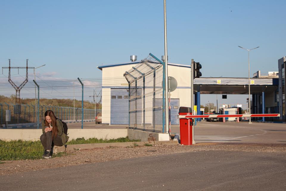 A woman arrives in Moldova from Ukraine at the Palanca border crossing April 26.