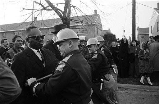 Police stand firm as demonstrators attempt to push through their lines during a March 13, 1965, civil rights protest in Selma, Alabama. The use of the term “woke” became more widely used during the civil rights era.