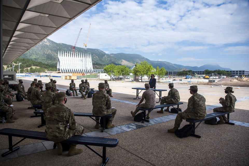 In this image provided by the U.S. Air Force Academy, academy cadets start the school year with a mix of reduced class sizes and remote learning on Aug. 12, 2020, at the U.S. Air Force Academy in Colorado Springs, Colo. Under the siege of the coronavirus pandemic, classes have begun at the Naval Academy, the Air Force Academy and the U.S. Military Academy at West Point. But unlike at many colleges around the country, most students are on campus and many will attend classes in person. (Trevor Cokley/U.S. Air Force Academy via AP)