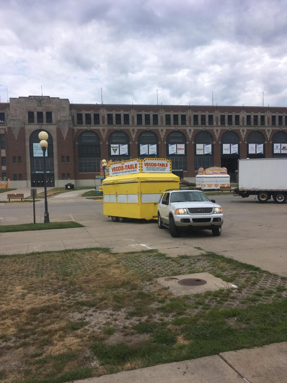The Veggie Table stand being moved to its location on the Grand Concourse ahead of the Iowa State Fair. The family purchased a new stand in 2000, which is still in use today.