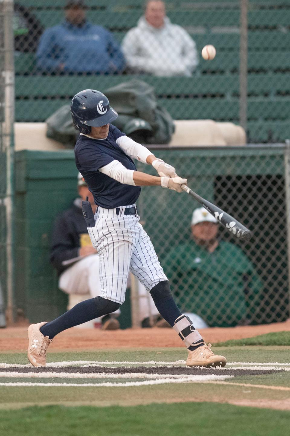 Pueblo Central's Ethan Ayala hits a fly ball during a South-Central League matchup with Pueblo County at Hobbs Field on Tuesday, May 3, 2022.